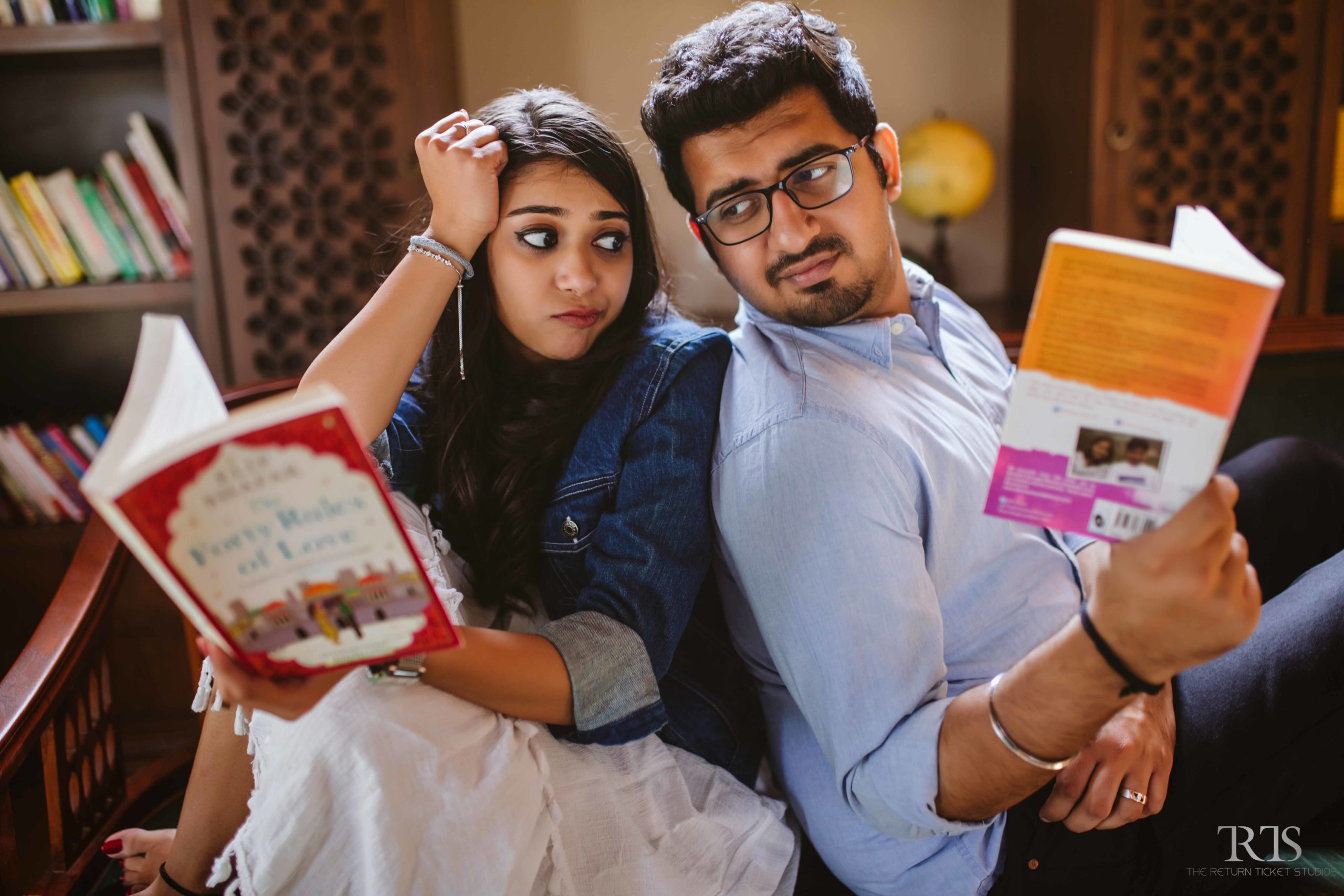 couple reading books Beautiful candid photography of pre wedding and wedding by The Return Ticket Studios 