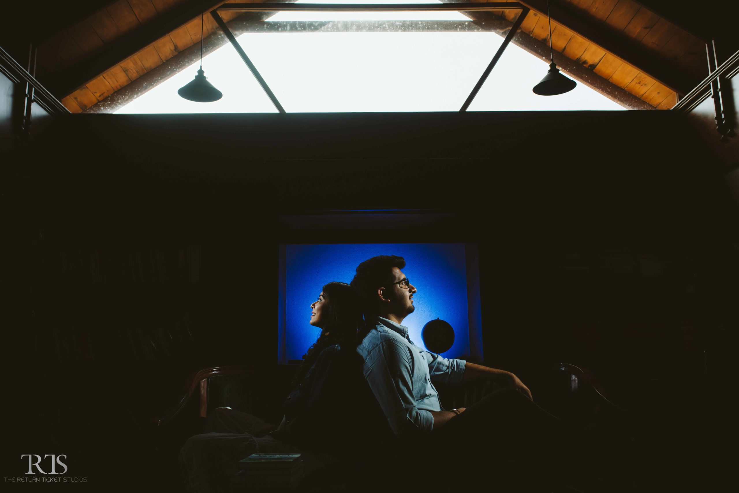 beautiful couple shot in blue light at the rustic villa Beautiful candid photography of pre wedding and wedding by The Return Ticket Studios 