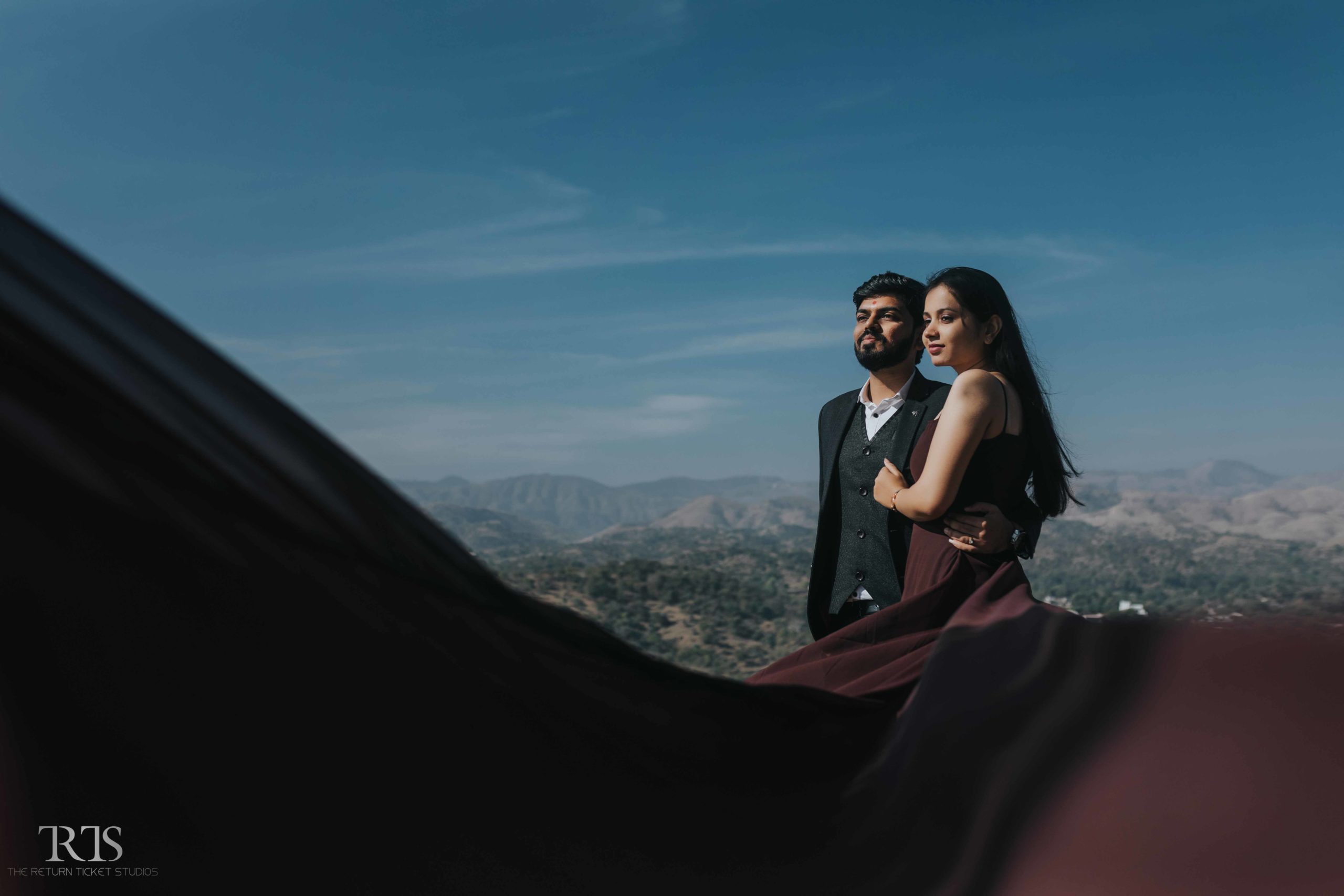 couple standing in the badi lake Beautiful candid photography of pre wedding and wedding by The Return Ticket Studios 